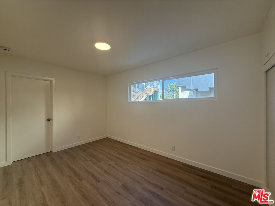 1314 10th Street, Unit A Santa Monica, CA 90401 - Photo 38 of 53 a view of wooden floor and windows in a room