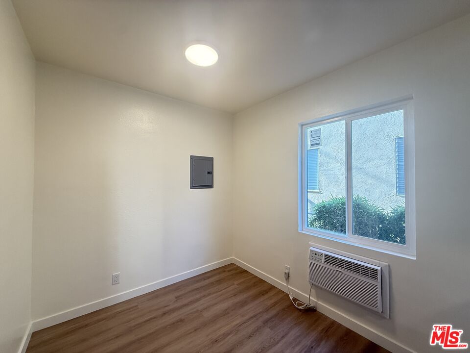 1314 10th Street, Unit A Santa Monica, CA 90401 - Photo 50 of 53 an empty room with wooden floor and windows