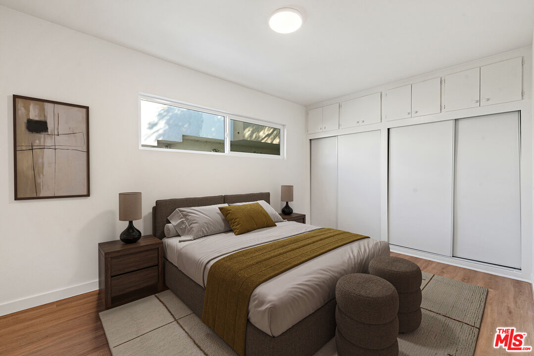 1314 10th Street, Unit A Santa Monica, CA 90401 - Photo 6 of 53 a bedroom with bed and a night stand