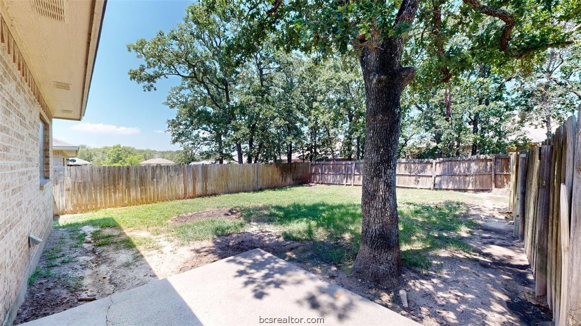 4453-4455 Reveille Road College Station, TX 77845 - Photo 18 of 37 a backyard of a house with lots of green space