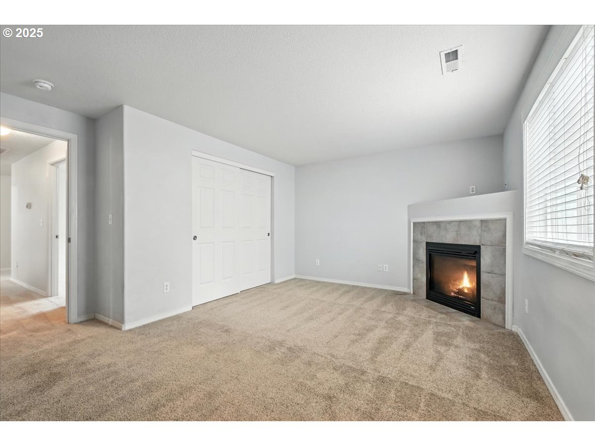 3044 South 3rd Way Ridgefield, WA 98642 - Photo 20 of 34 a view of an empty room with a fireplace