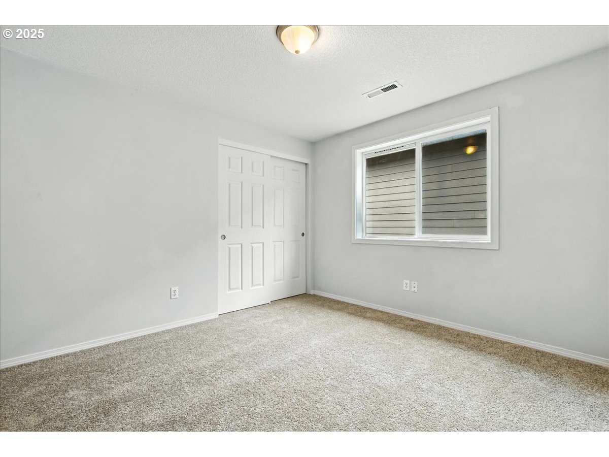 3044 South 3rd Way Ridgefield, WA 98642 - Photo 25 of 34 a view of an empty room with a window