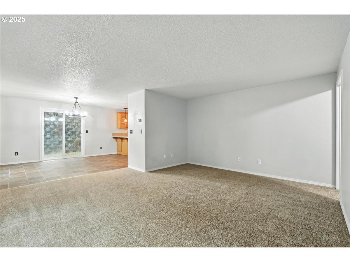 3044 South 3rd Way Ridgefield, WA 98642 - Photo 7 of 34 a view of an empty room with a kitchen