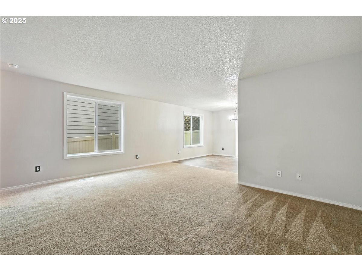 3044 South 3rd Way Ridgefield, WA 98642 - Photo 8 of 34 a view of an empty room with a window