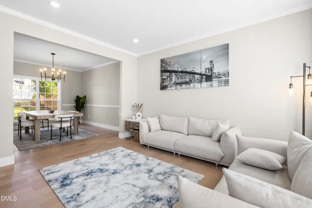 a large kitchen with kitchen island a sink table and chairs