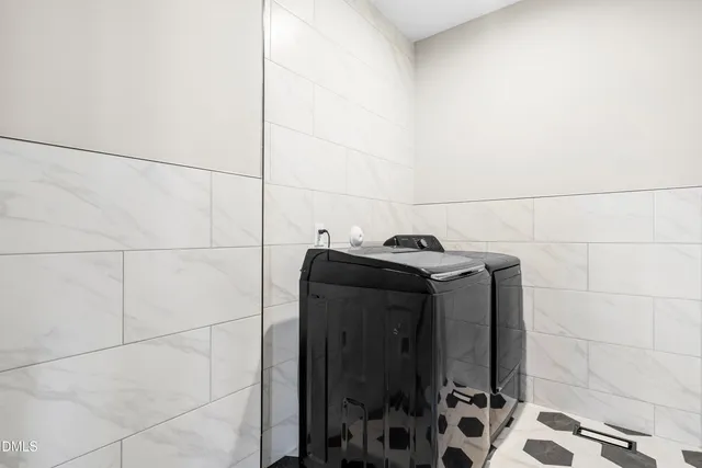 a spacious bedroom with a bed and a cabinets