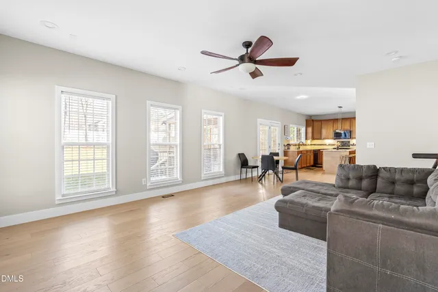 a spacious bathroom with a granite countertop sink and a mirror