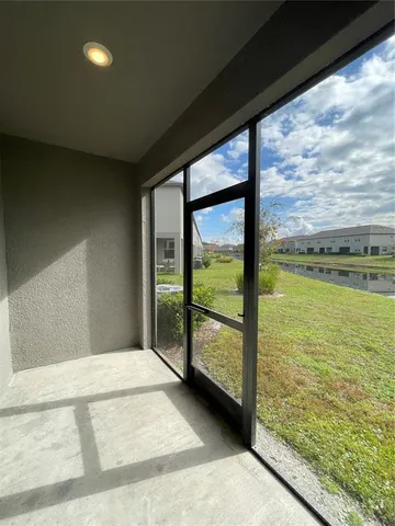 an aerial view of a pool yard swimming pool and outdoor seating