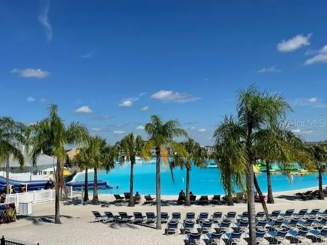 a view of a swimming pool with a patio