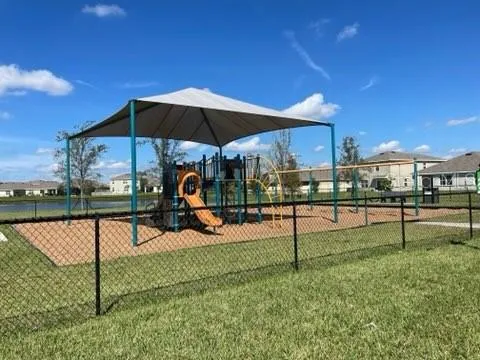 a view of a swimming pool with a yard
