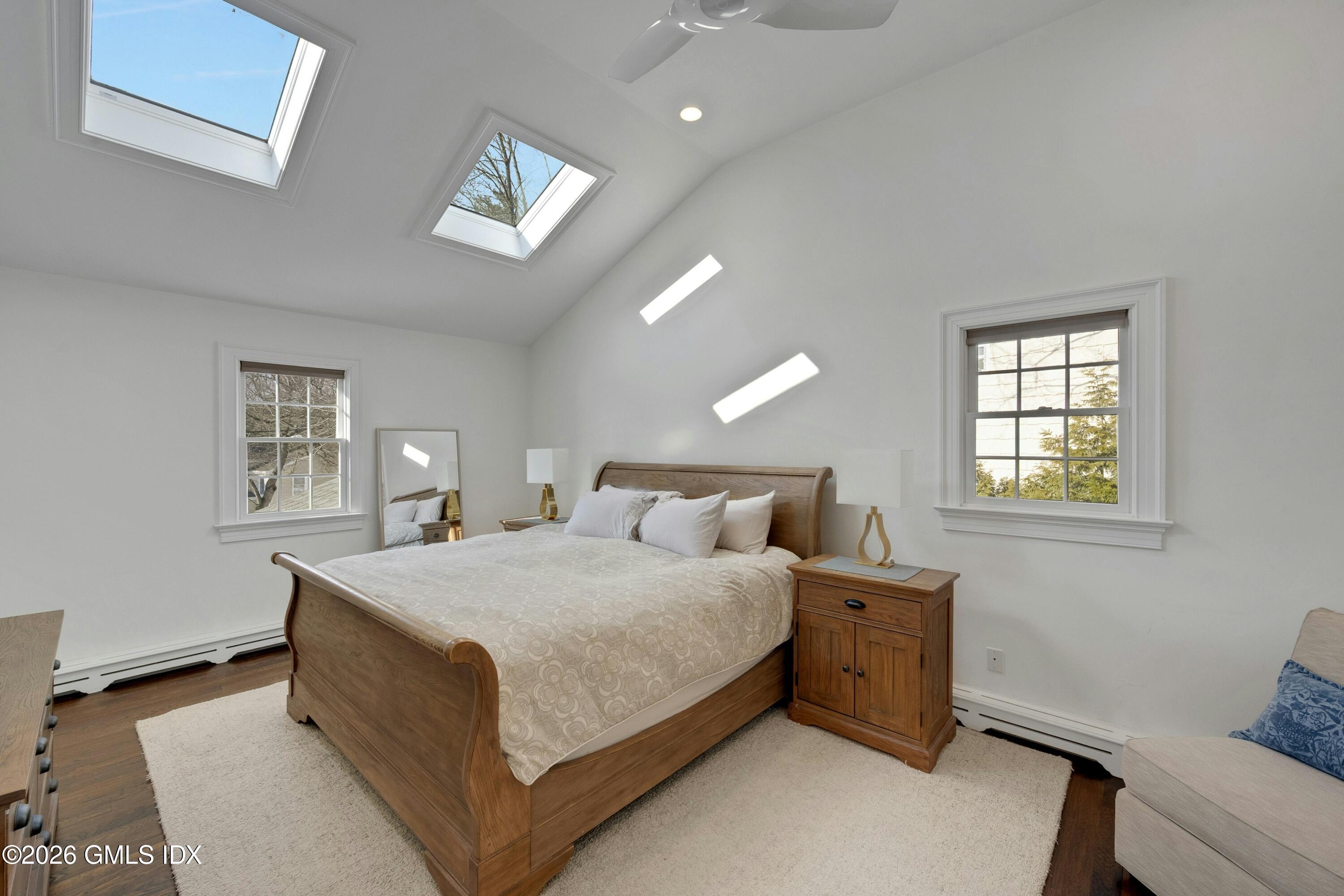 98 Hillcrest Park Road Cos Cob, CT 06807 - Photo 12 of 27 a bedroom with a bed and a window
