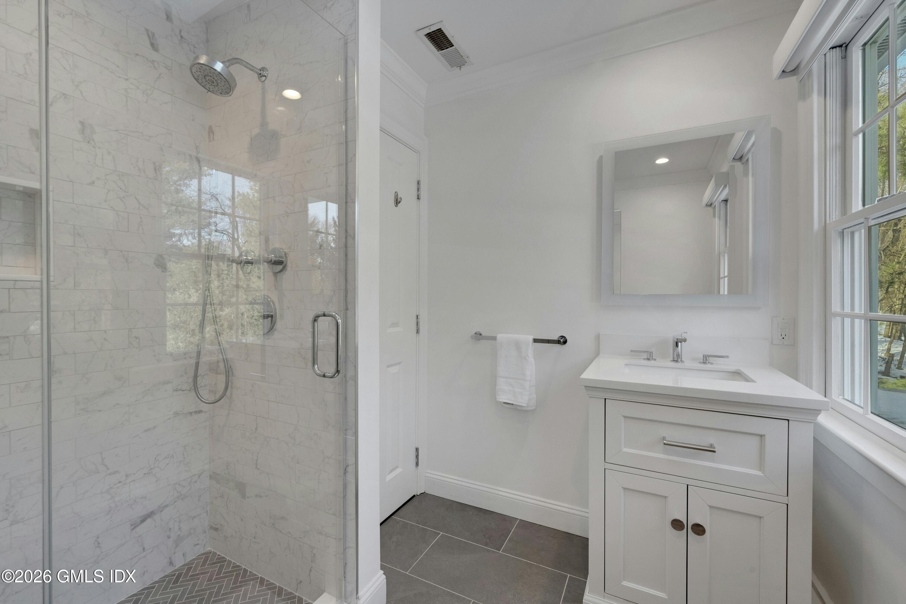 98 Hillcrest Park Road Cos Cob, CT 06807 - Photo 13 of 27 a bathroom with a sink and mirror