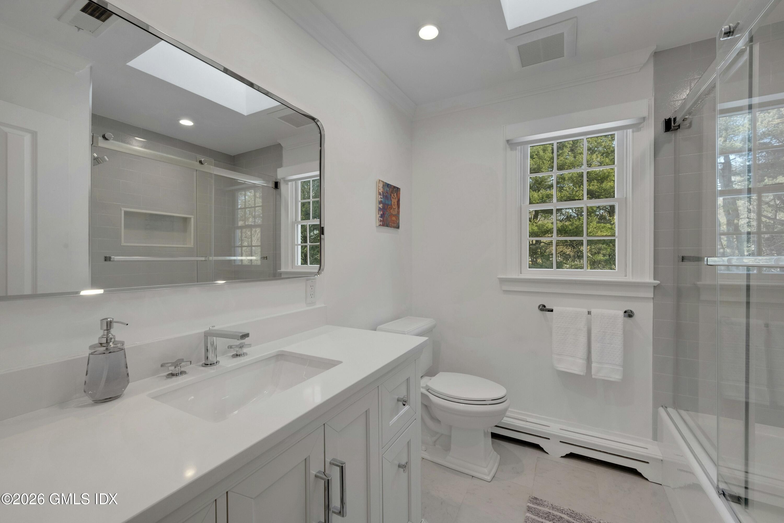 98 Hillcrest Park Road Cos Cob, CT 06807 - Photo 17 of 27 a bathroom with a toilet sink and mirror