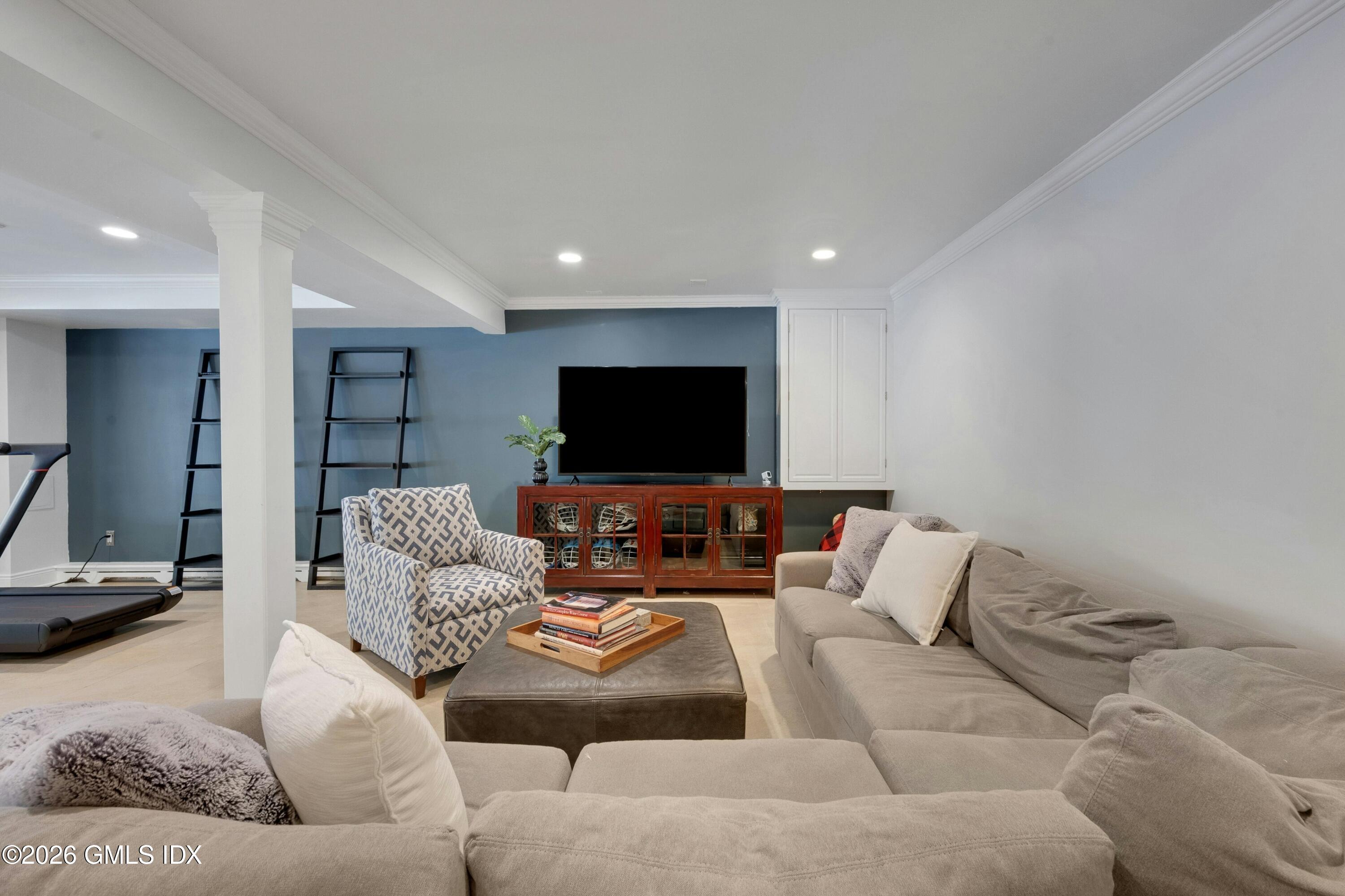 98 Hillcrest Park Road Cos Cob, CT 06807 - Photo 18 of 27 a living room with furniture and a flat screen tv