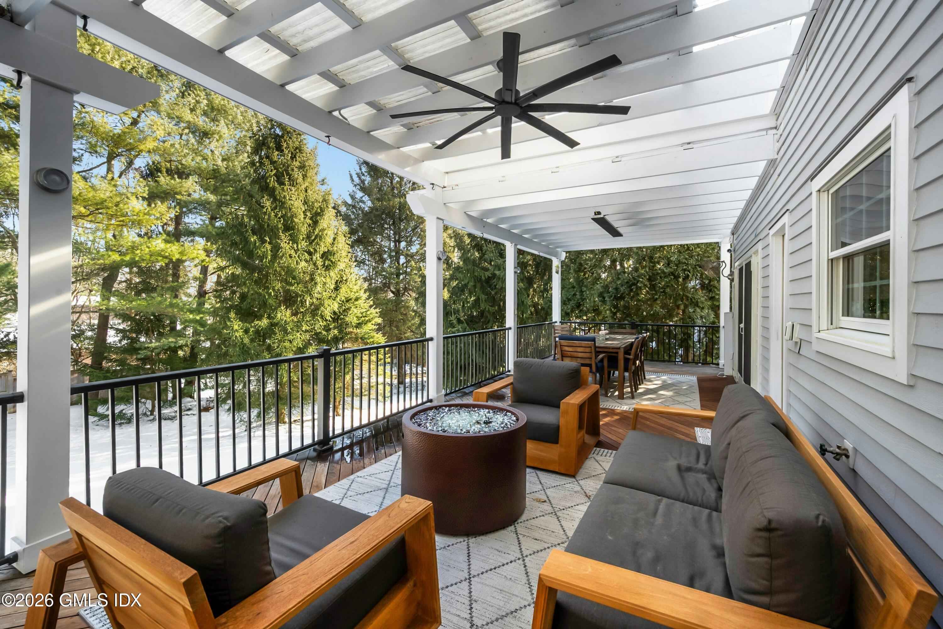98 Hillcrest Park Road Cos Cob, CT 06807 - Photo 21 of 27 a view of a patio with couches chairs and a potted plant
