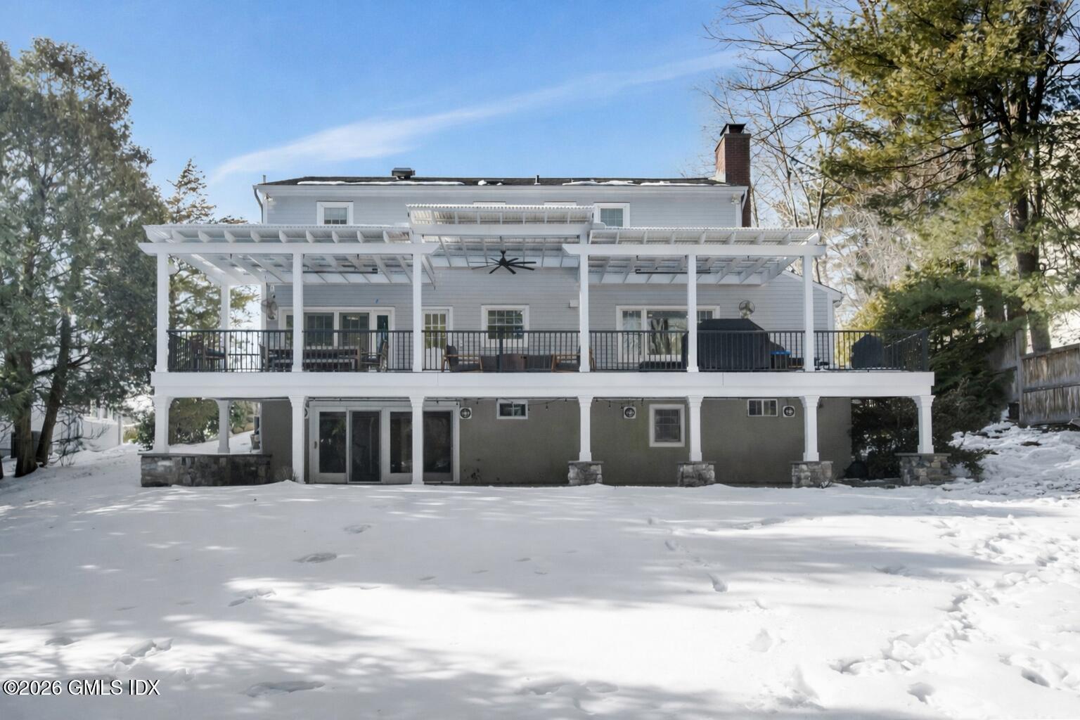 98 Hillcrest Park Road Cos Cob, CT 06807 - Photo 23 of 27 a front view of a building with a garden