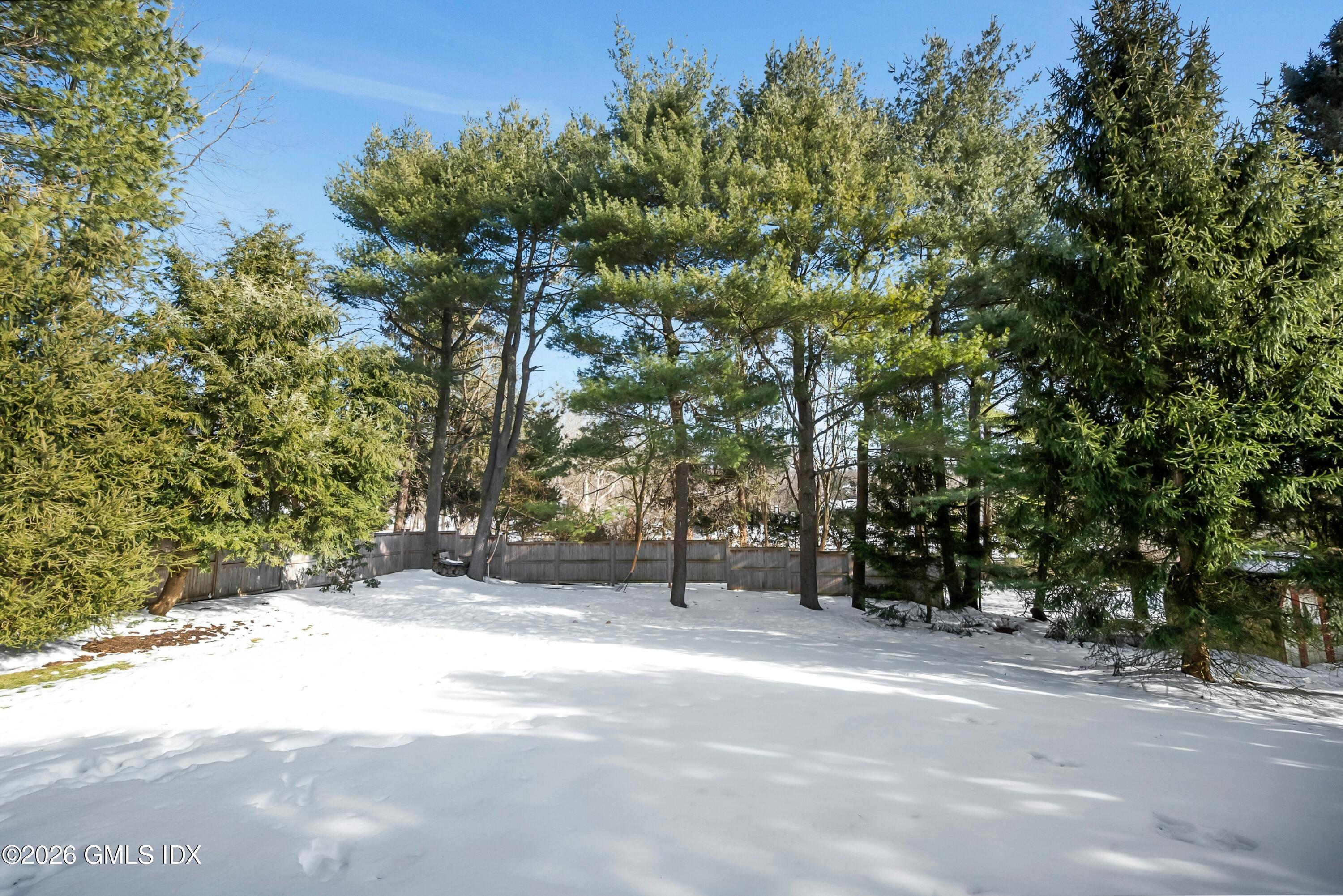 98 Hillcrest Park Road Cos Cob, CT 06807 - Photo 24 of 27 a view of road with trees