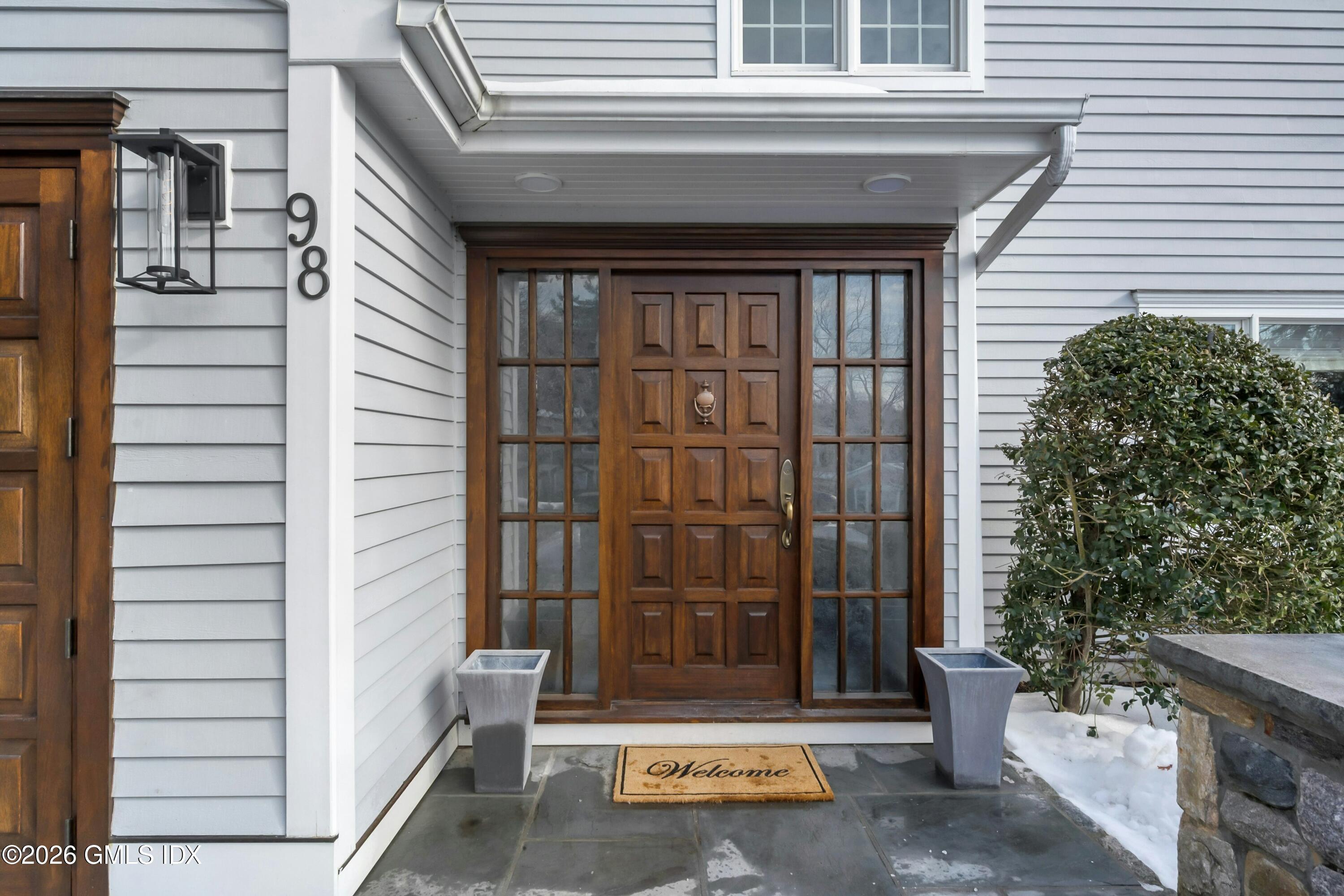 98 Hillcrest Park Road Cos Cob, CT 06807 - Photo 3 of 27 a view of a door and chair