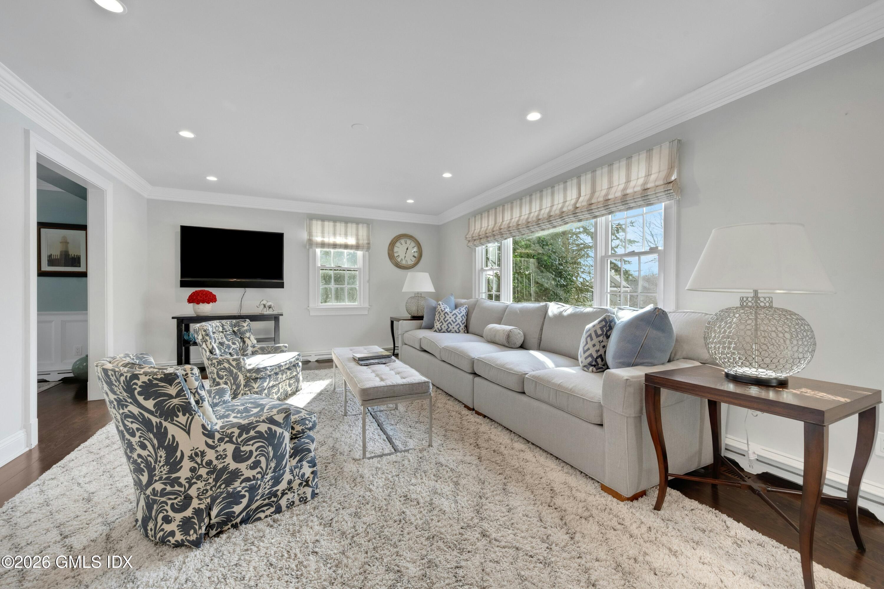 98 Hillcrest Park Road Cos Cob, CT 06807 - Photo 6 of 27 a living room with furniture and a flat screen tv