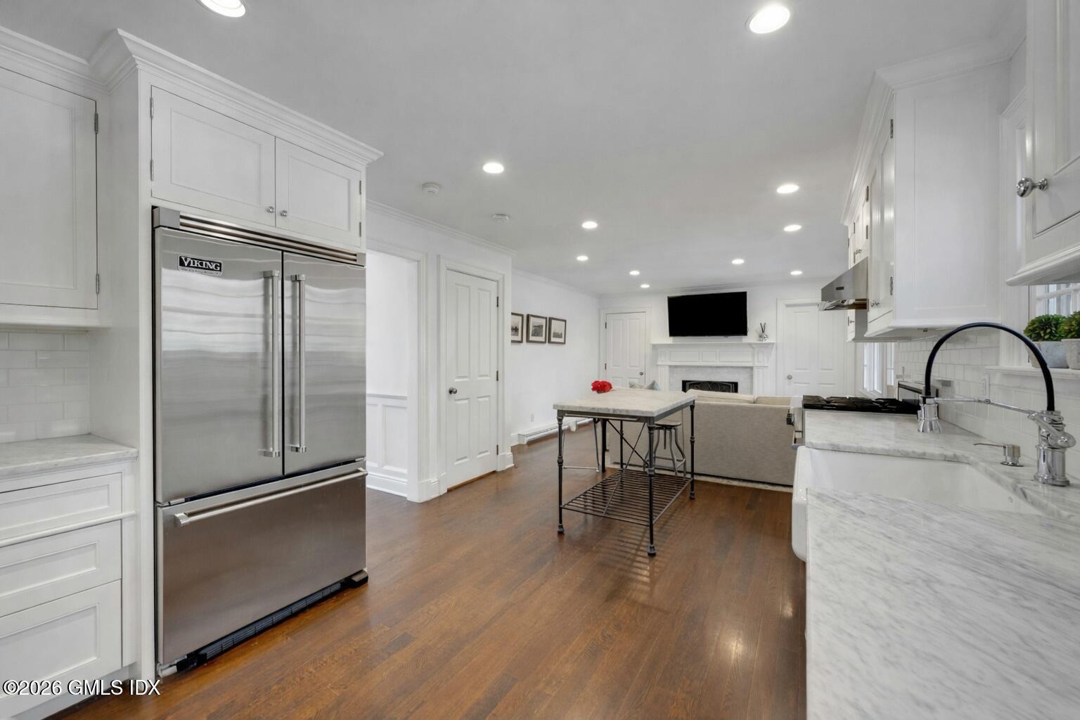 98 Hillcrest Park Road Cos Cob, CT 06807 - Photo 9 of 27 a kitchen with stainless steel appliances granite countertop a refrigerator and a stove top oven
