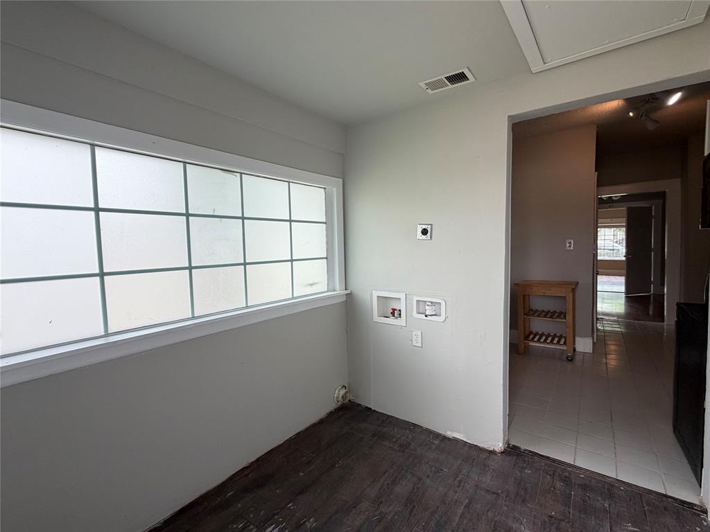 801 Wayne Street Dallas, TX 75223 - Photo 12 of 15 wooden floor in an empty room with a window