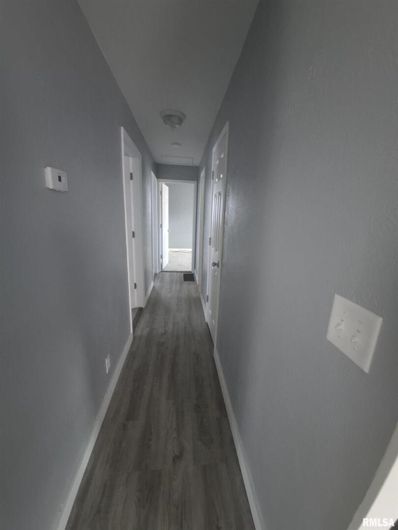 20 South Peach Street Du Quoin, IL 62832 - Photo 8 of 22 a view of a hallway with wooden floor