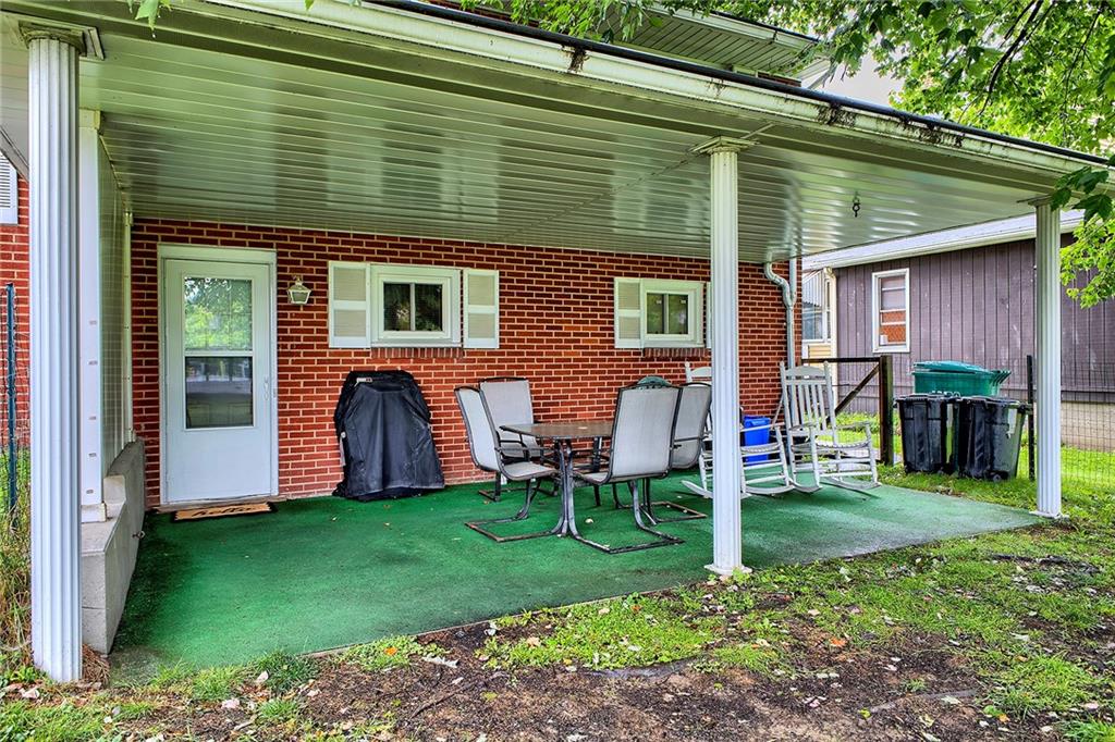 1119 Church Street Indiana, PA 15701 - Photo 30 of 34 a view of backyard with table and chairs and a barbeque
