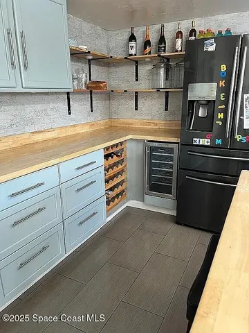 a kitchen with cabinets and appliances