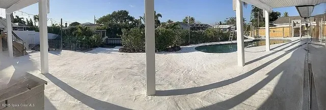 a view of a balcony with a potted plants