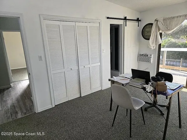 a floor to ceiling window with a rug