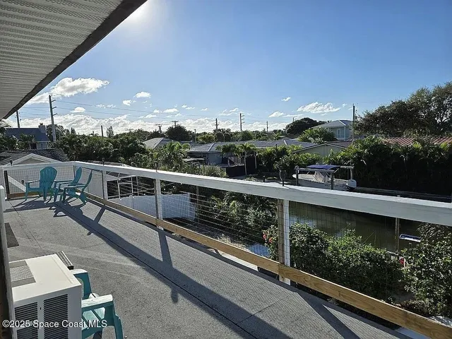 a terrace with outdoor seating and city view