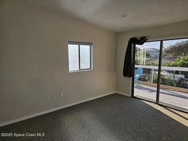 a view of a room with a large window