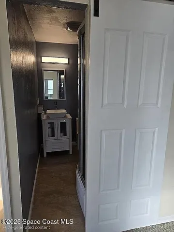 a bathroom with a glass shower door