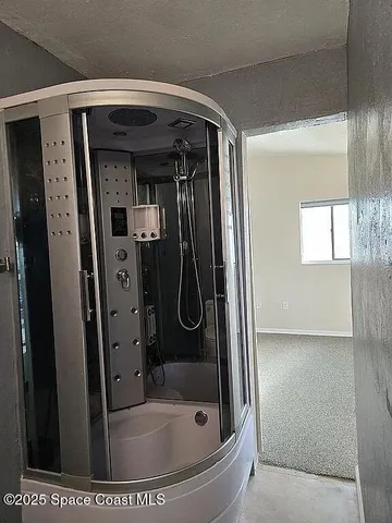 a view of balcony with wooden floor and fence