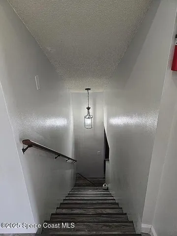 a view of a patio with a table and chairs