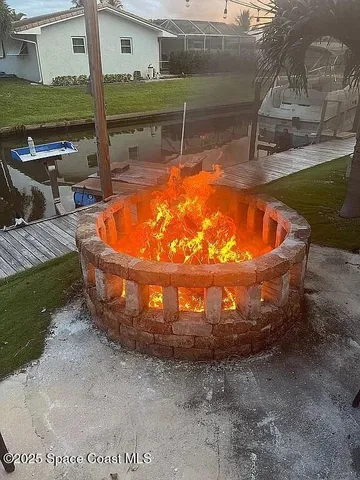 a view of a yard and palm trees