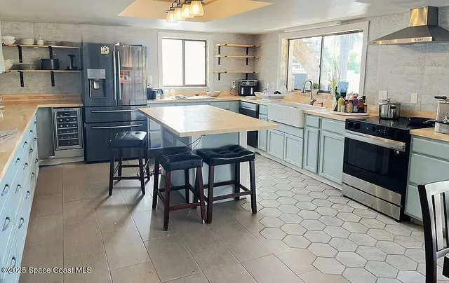 a large kitchen with a table and chairs