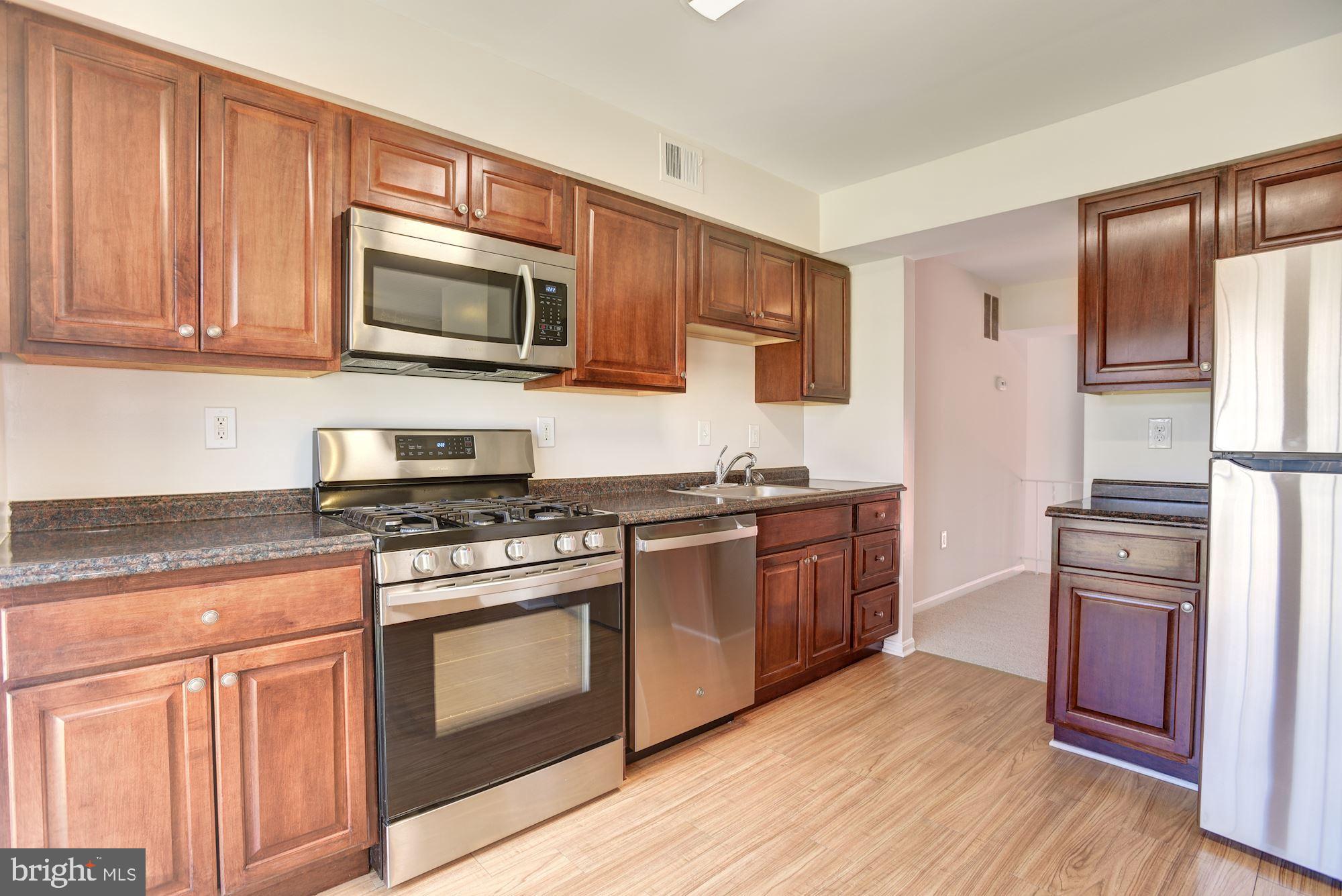 5624 Gulf Stream Row Columbia, MD 21044 - Photo 4 of 34 Sleek Stainless Steel Appliances