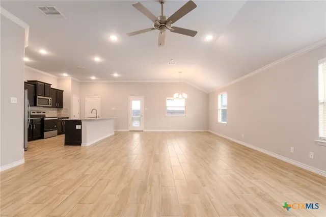 a view of a kitchen with a sink and a microwave
