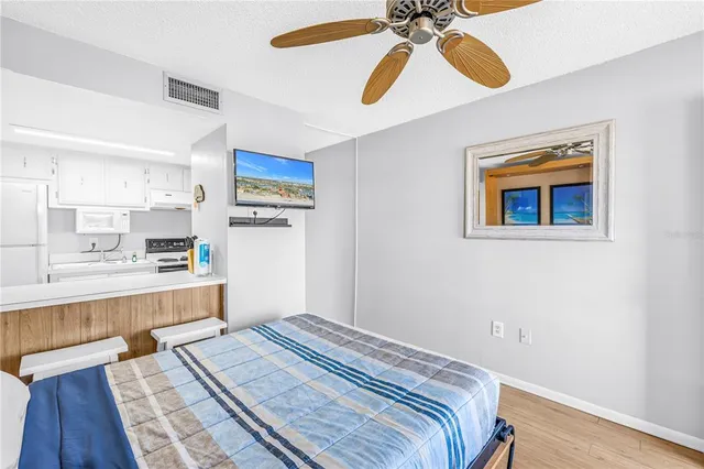 a kitchen with a stove and a refrigerator