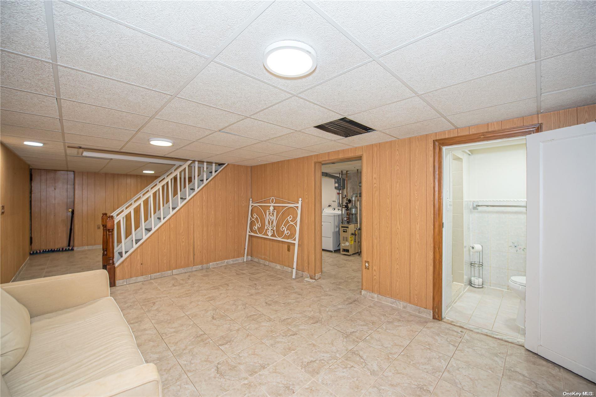 53-15 37th Road Queens, NY 11377 - Photo 16 of 25 a view of an empty room with wooden floor