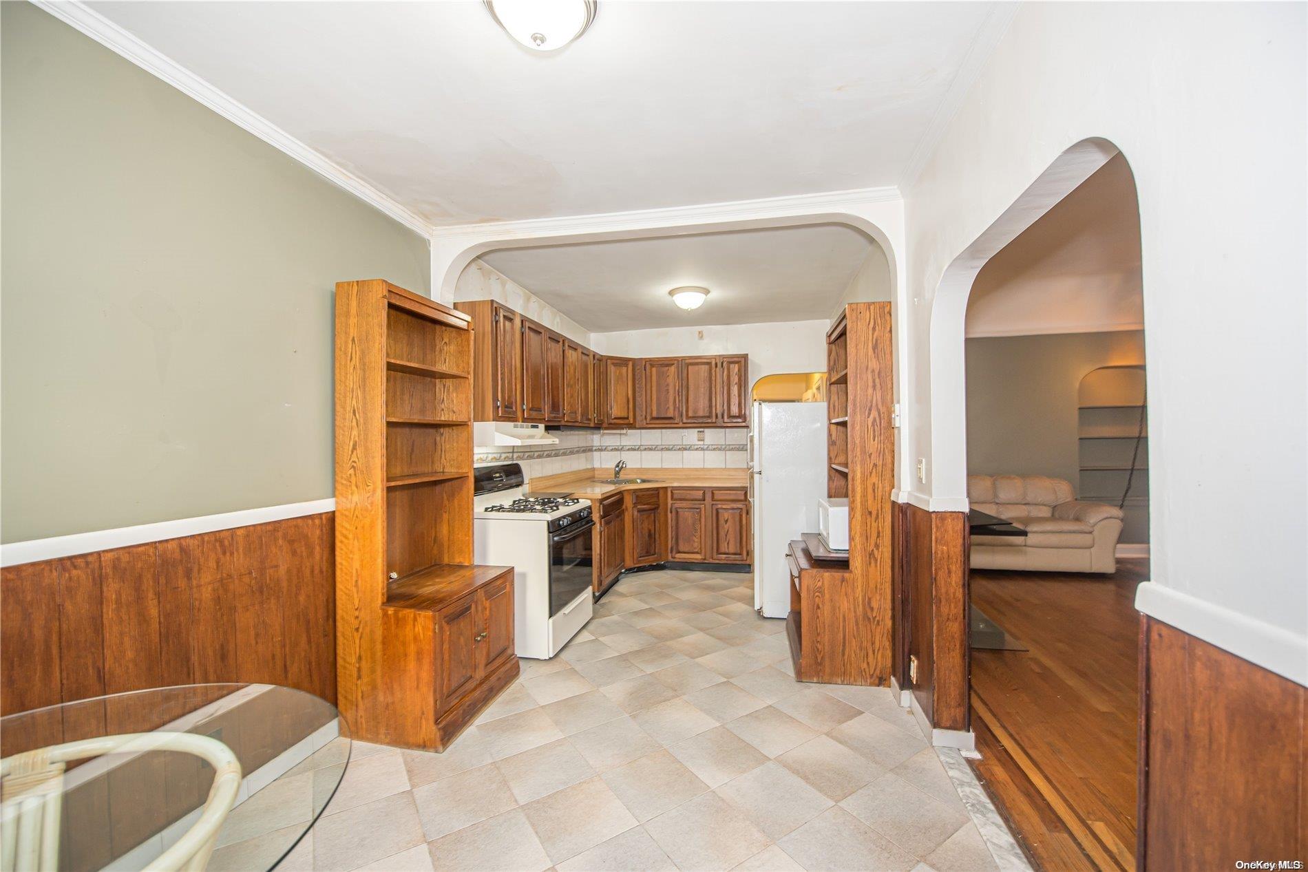 53-15 37th Road Queens, NY 11377 - Photo 8 of 25 a view of a kitchen with furniture and a kitchen view