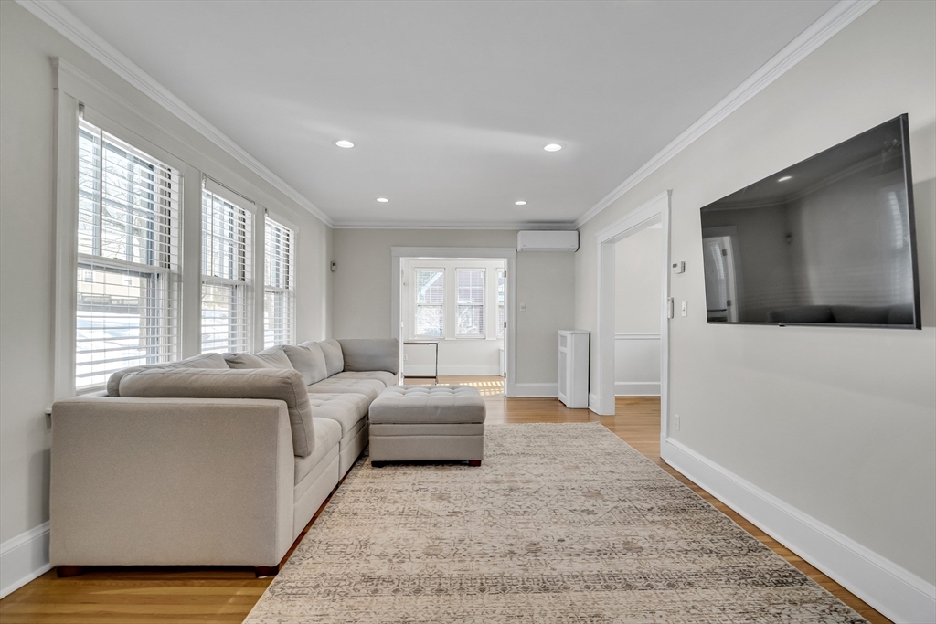 10 Dexter Road Lexington, MA 02420 - Photo 3 of 35 a living room with furniture and a flat screen tv