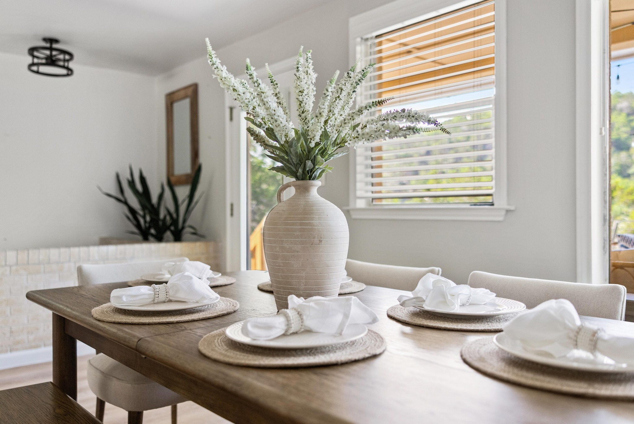13566 Bullick Hollow Road Austin, TX 78726 - Photo 15 of 32 a view of a dining room with furniture and a potted plant