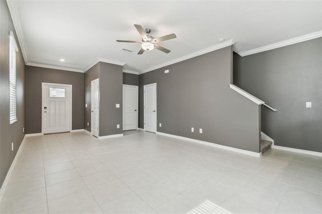 36390 Wl Hl Way Zephyrhills, FL 33541 - Photo 11 of 77 a view of an empty room with a chandelier fan
