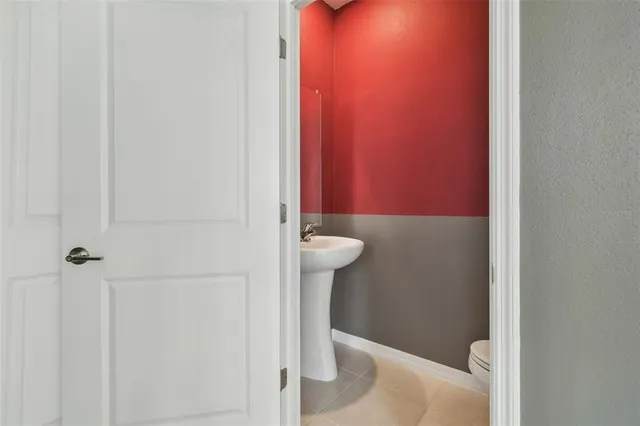 a kitchen with stainless steel appliances kitchen island granite countertop a stove and a sink