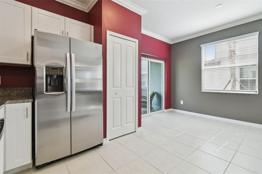 36390 Wl Hl Way Zephyrhills, FL 33541 - Photo 21 of 77 a kitchen with stainless steel appliances a refrigerator and a window