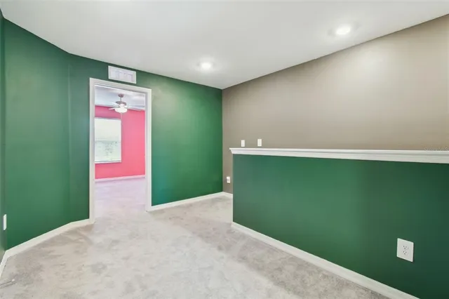 a bathroom with a granite countertop sink and a toilet