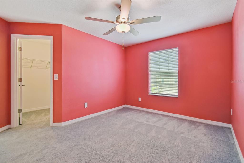 36390 Wl Hl Way Zephyrhills, FL 33541 - Photo 28 of 77 an empty room with windows and fan