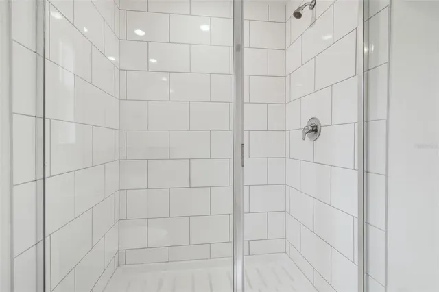 an aerial view of residential houses with outdoor space and parking